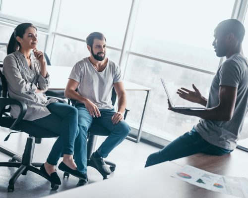 Young professional team discussing business plan in the office